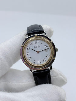 Montre HERMÈS "Clipper" en or jaune, acier et cuir - Castafiore