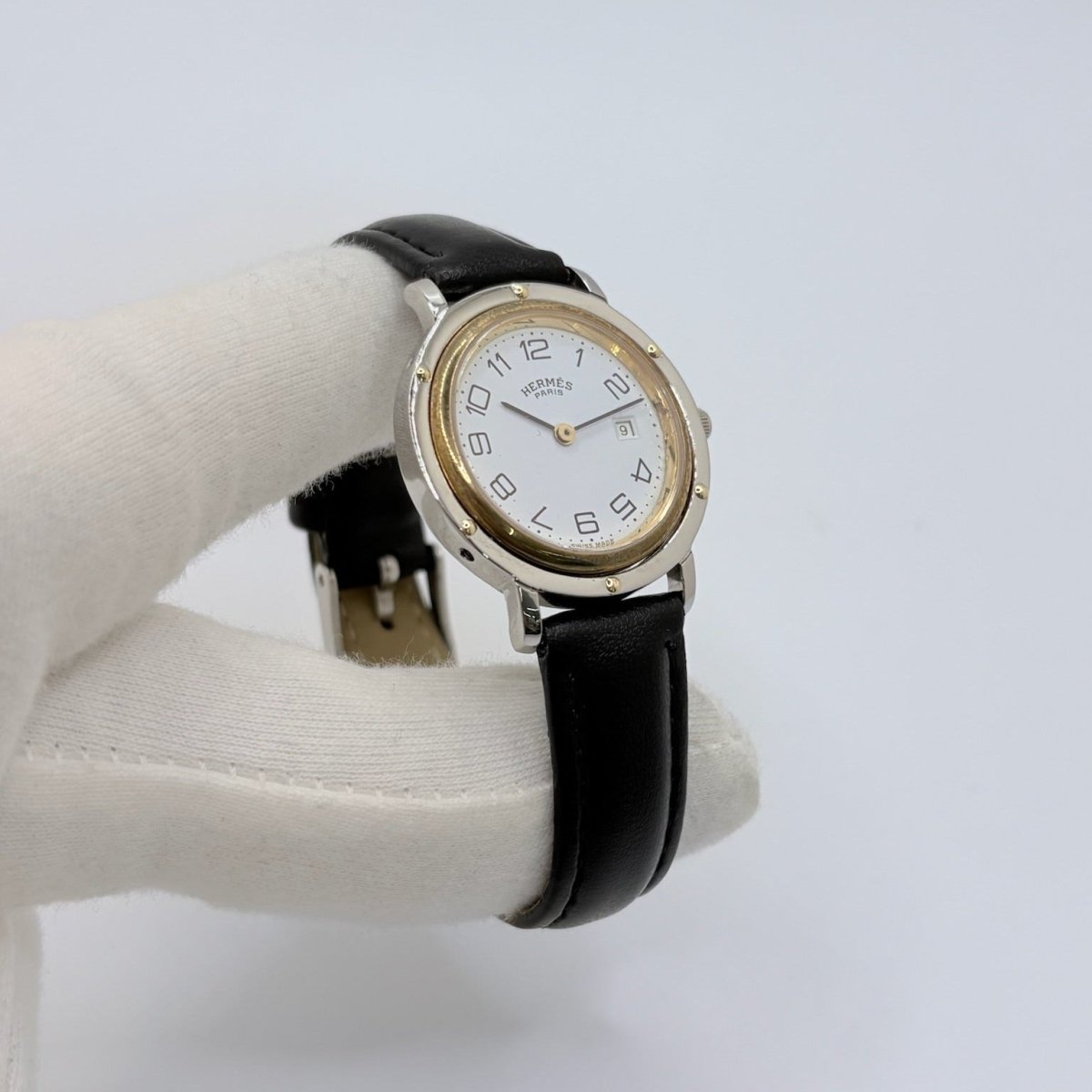 Montre HERMÈS "Clipper" en or jaune, acier et cuir - Castafiore