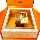 Montre Hermès Kelly , cadran PM plaqué or, double tour de poignet cuir marron - Castafiore