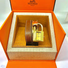 Montre HERMÈS "Kelly" en cuir et plaqué or - Castafiore