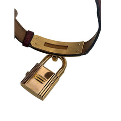 Montre HERMÈS "Kelly" en métal plaqué or et cuir - Castafiore