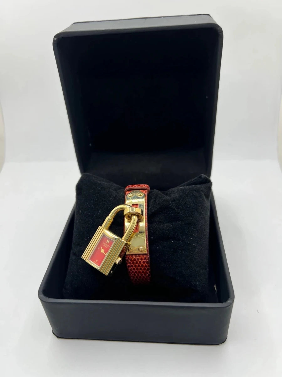 Montre HERMÈS "Kelly" plaqué or, acier et cuir - Castafiore