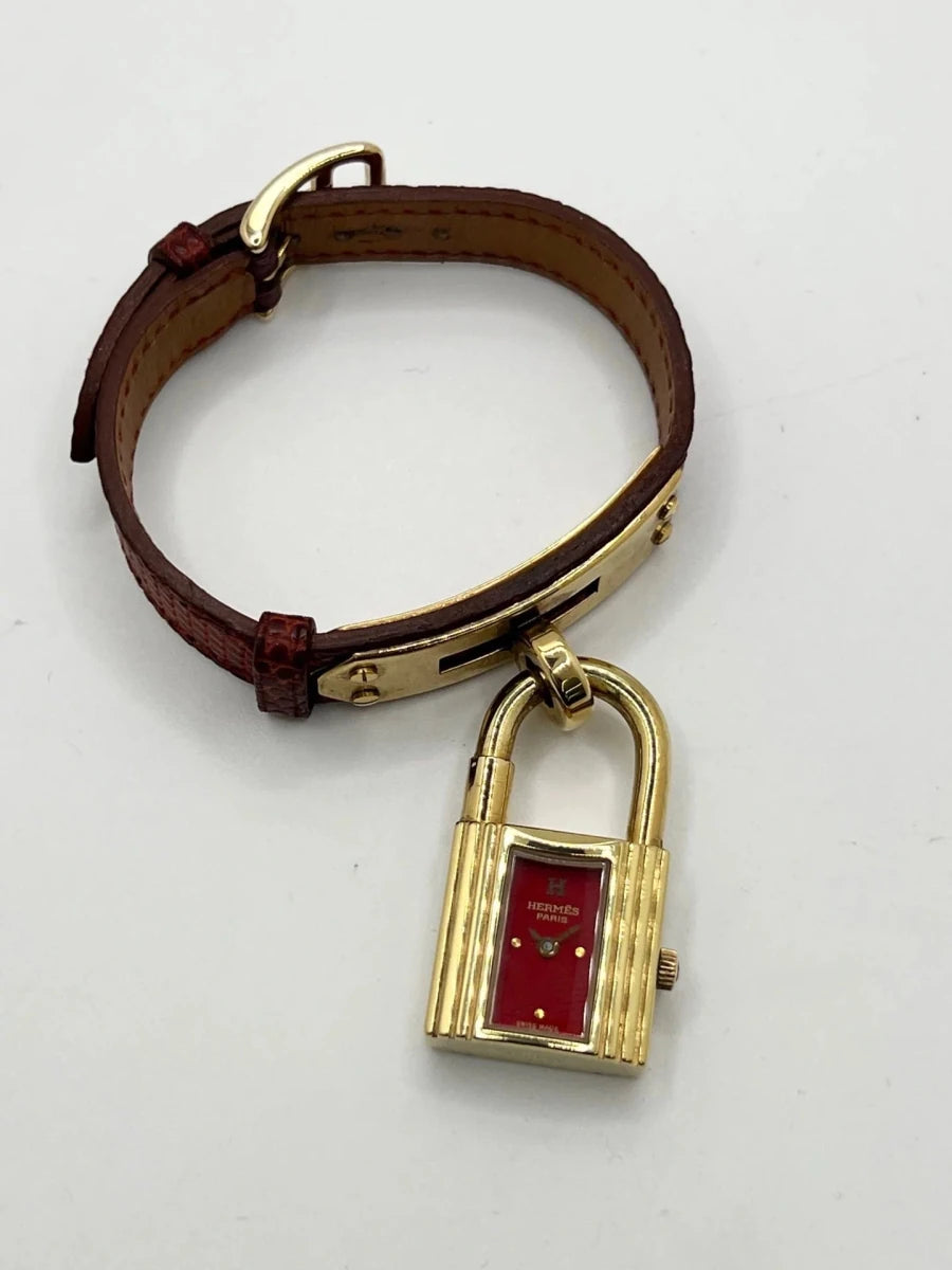 Montre HERMÈS "Kelly" plaqué or, acier et cuir - Castafiore