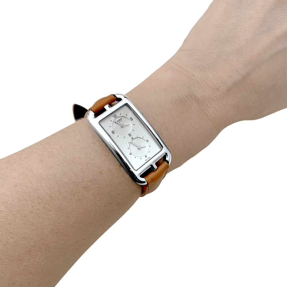 Montre HERMÈS "Nantucket Dual Time" en acier, argent, cuir et diamants - Castafiore
