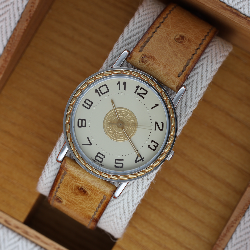 Montre HERMÈS "Sellier" en or jaune et acier - Castafiore