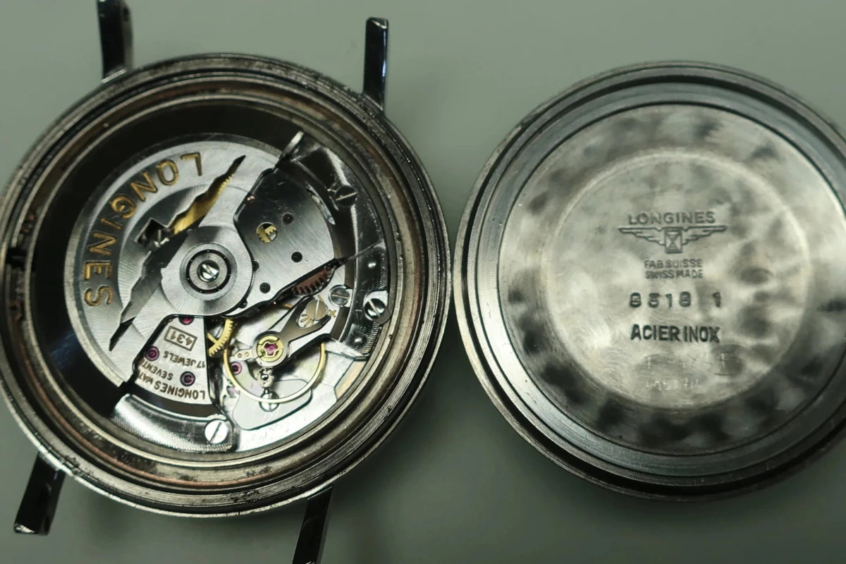 Montre LONGINES "Ultra-Chron" en acier et cuir - Castafiore