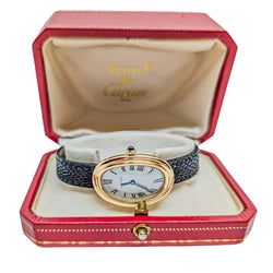 Montre Mécanique CARTIER "Baignoire" en or jaune, cuir et saphir - Castafiore