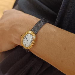Montre Mécanique CARTIER "Baignoire" en or jaune, cuir et saphir - Castafiore