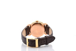 Montre MOVADO "Triple Calendar" en or jaune, plexi et cuir - Castafiore