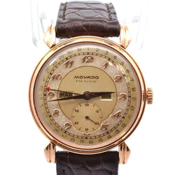 Montre MOVADO "Triple Calendar" en or jaune, plexi et cuir - Castafiore