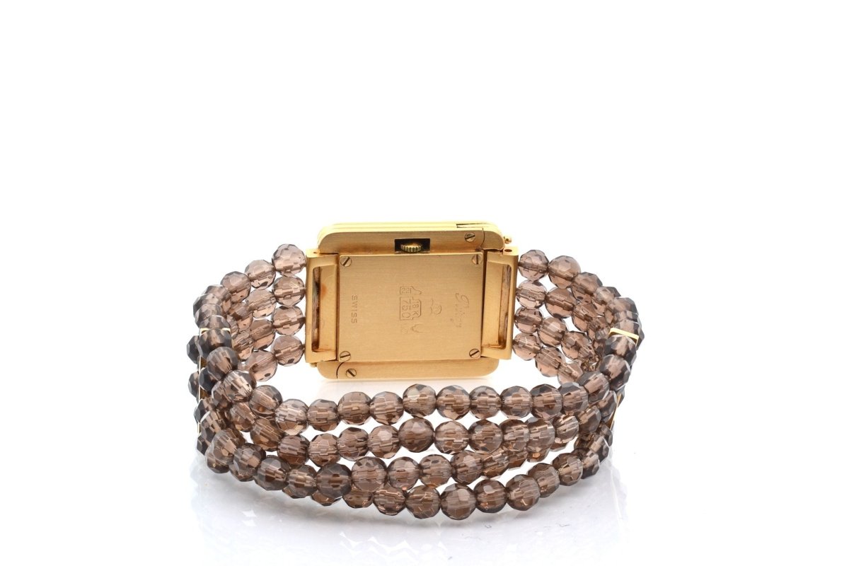 Montre POIRAY en or jaune, quartz et saphir - Castafiore