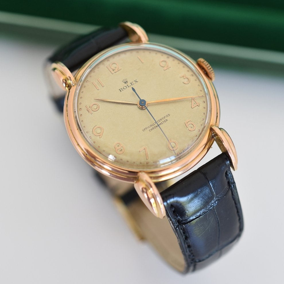 Montre ROLEX "Chronomètre" en or rose, acier et cuir - Castafiore