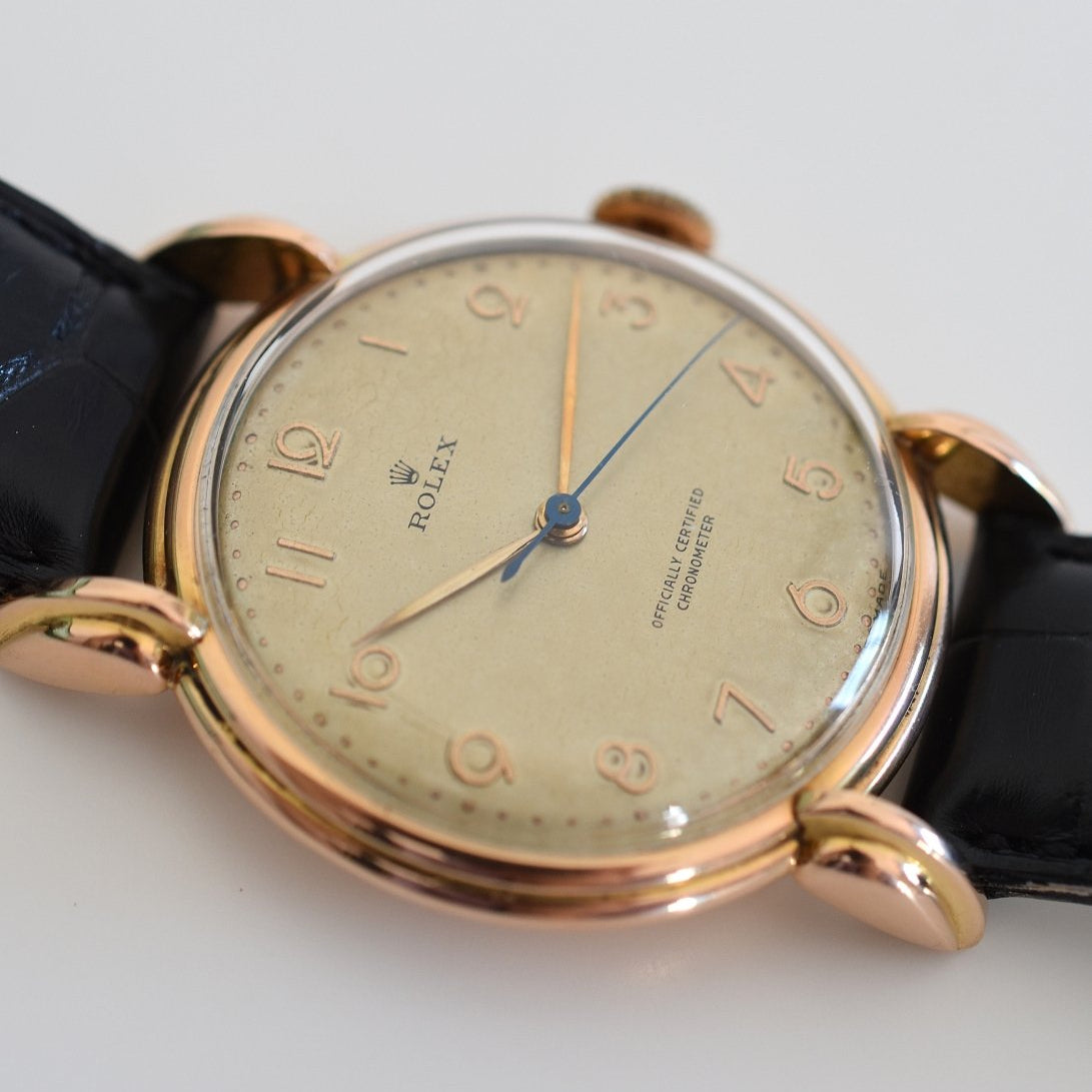 Montre ROLEX "Chronomètre" en or rose, acier et cuir - Castafiore