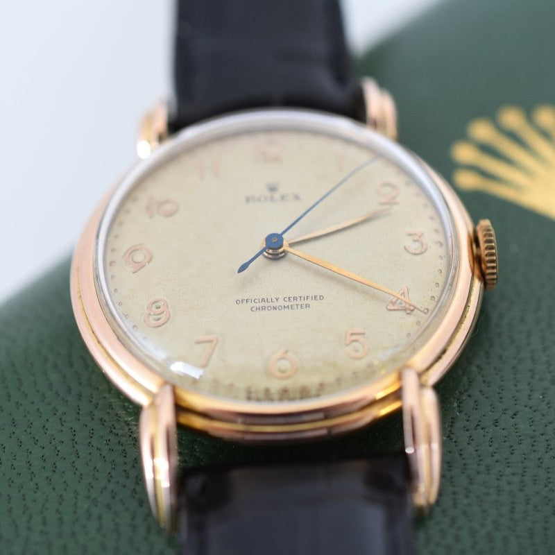 Montre ROLEX "Chronomètre" en or rose, acier et cuir - Castafiore