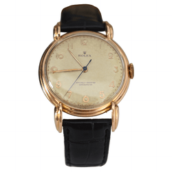 Montre ROLEX "Chronomètre" en or rose, acier et cuir - Castafiore