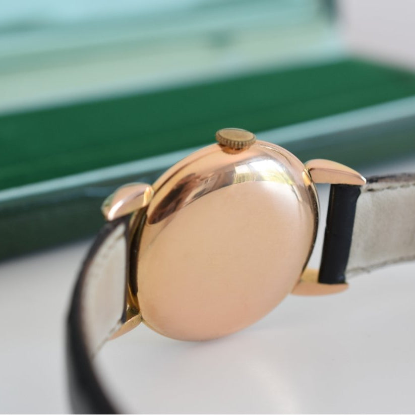 Montre ROLEX "Chronomètre" en or rose, acier et cuir - Castafiore