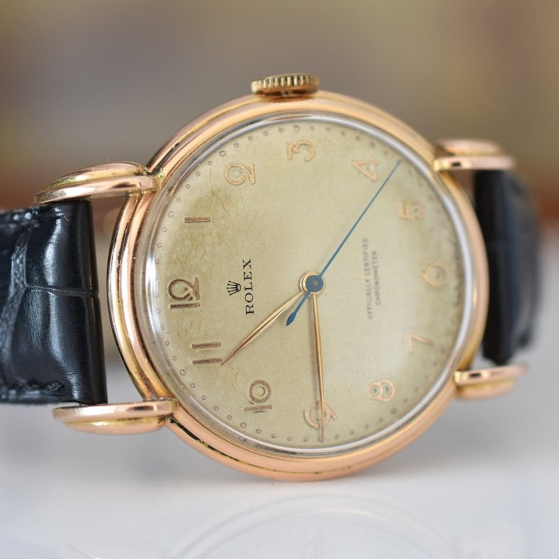 Montre ROLEX "Chronomètre" en or rose, acier et cuir - Castafiore