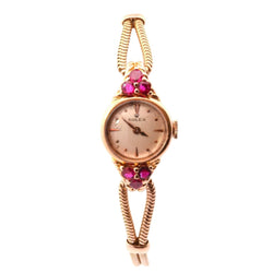 Montre ROLEX en or jaune et rubis - Castafiore