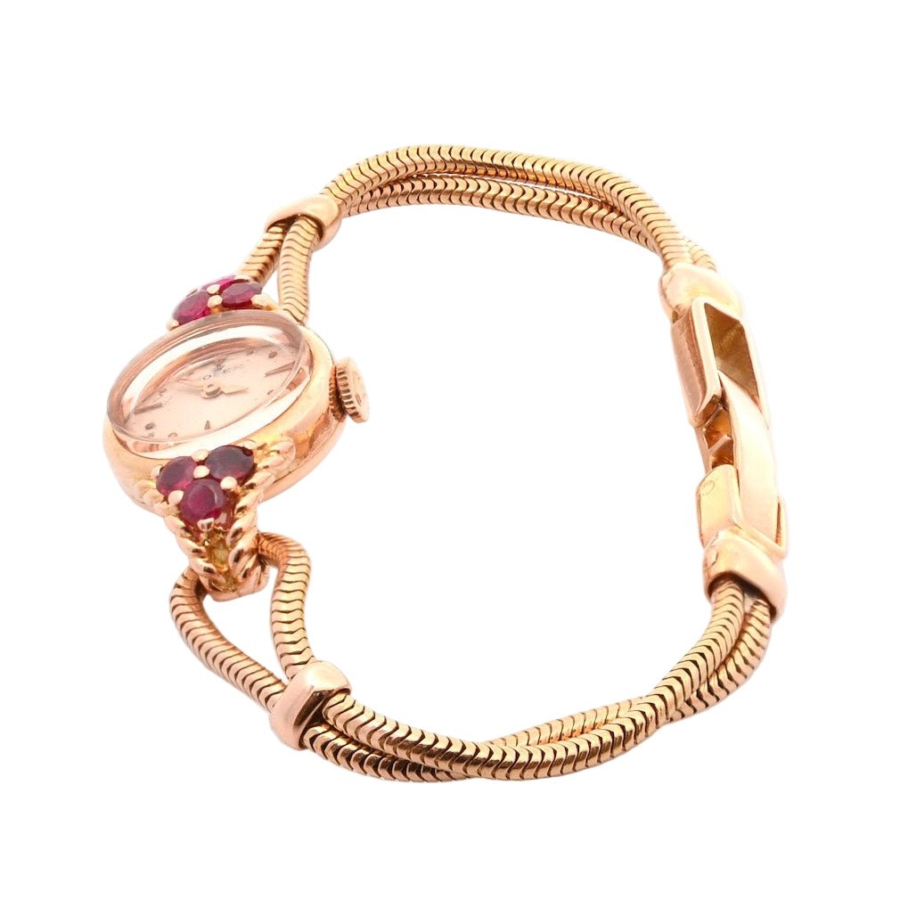 Montre ROLEX en or jaune et rubis - Castafiore
