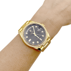 Montre ROLEX "Oyster perpetual day-date" en or jaune et diamants - Castafiore