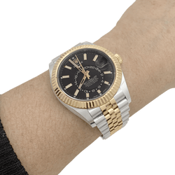 Montre Rolex Sky Dweller en acier et or jaune - Castafiore