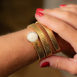 Montre Tubogas PIAGET en or jaune et or blanc - Castafiore