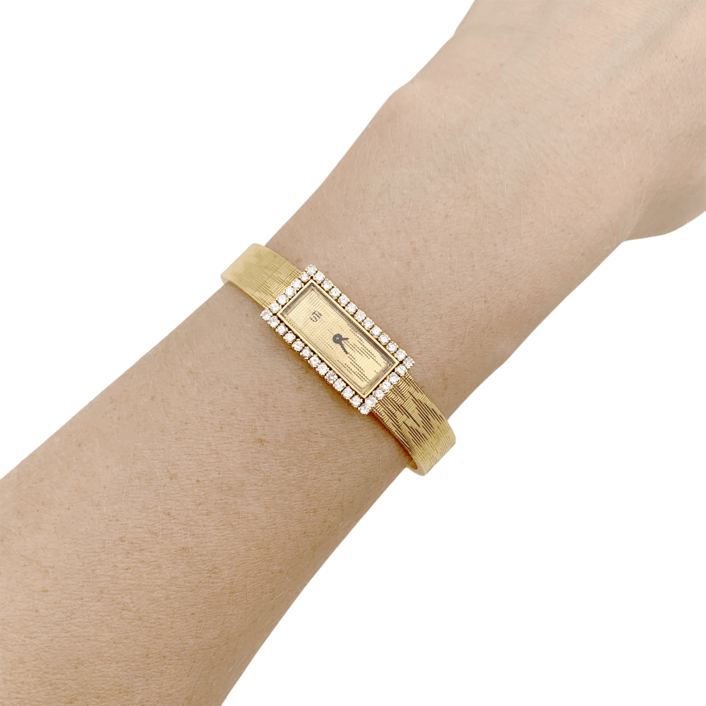 Montre UTI en or jaune et diamants - Castafiore