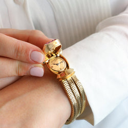 Montre UTI Secret tubogas en or jaune diamants rubis - Castafiore