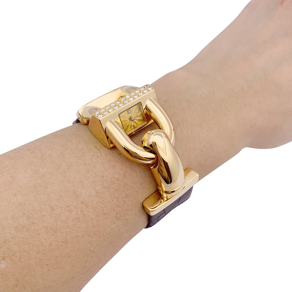 Montre Van Cleef & Arpels "Cadenas" or jaune, diamants, cuir. - Castafiore