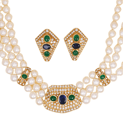 Parure REPOSSI en or jaune, perles, saphirs, émeraudes et diamants - Castafiore