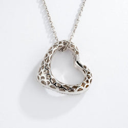 Pendentif en or gris formant un cœur pavée de diamants - Castafiore