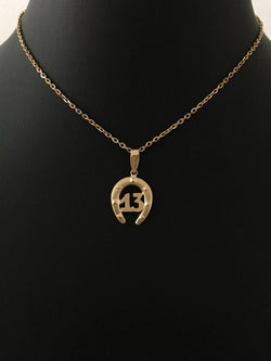 Pendentif en or jaune 18K en forme de fer à cheval