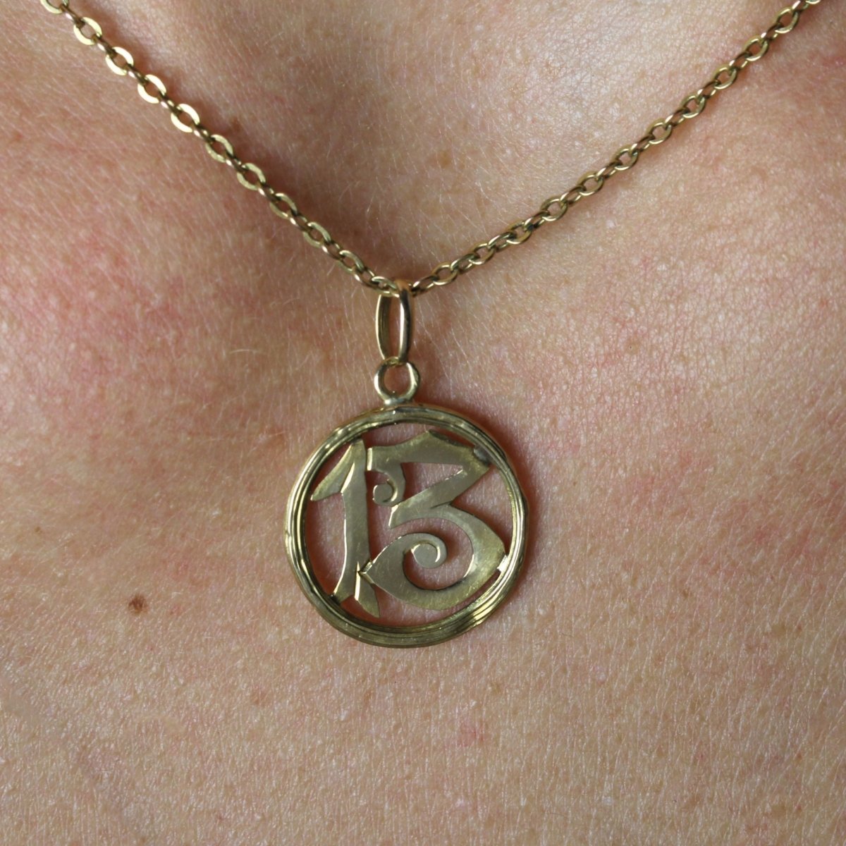 Antique number 13 pendant