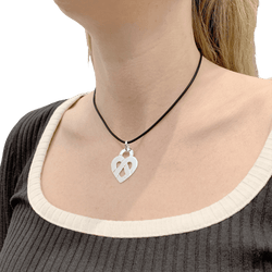 Poiray pendant, "Coeur Entrelacé", white gold.