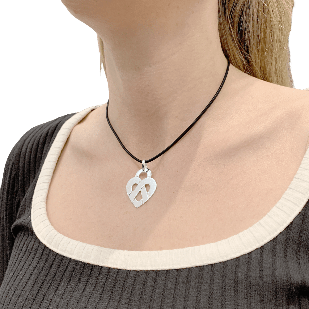 Poiray pendant, "Coeur Entrelacé", white gold.