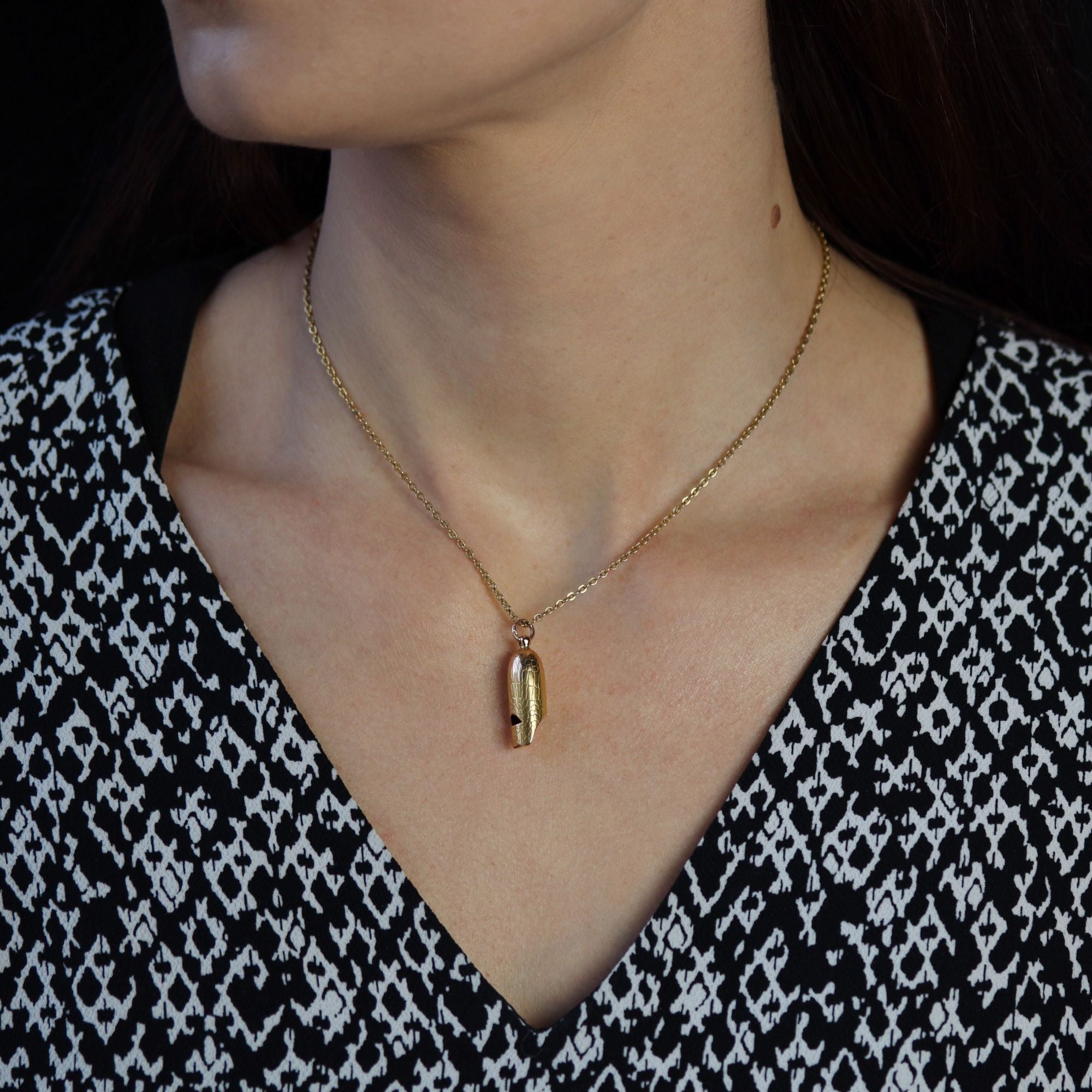 Antique gold-plated whistle pendant