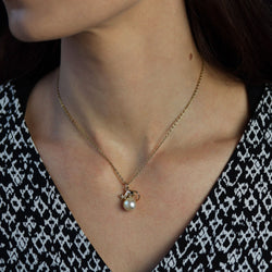 Gold mouse pendant on cultured pearl