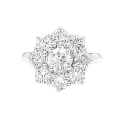 Bague Marguerite en or blanc et platine, sertie de diamants.