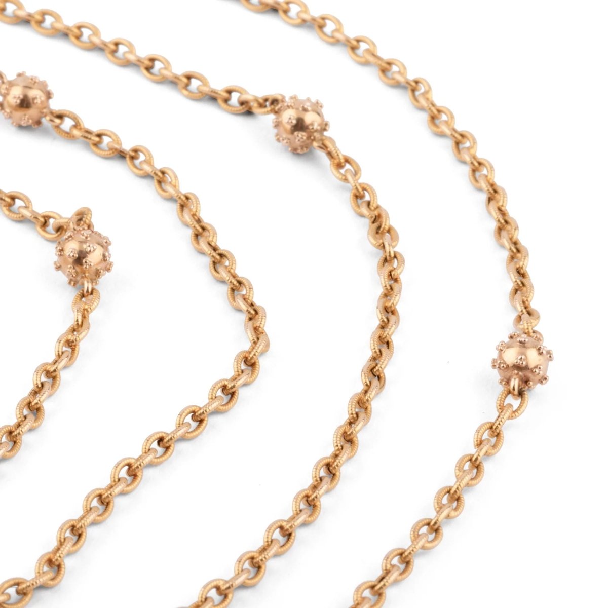 Sautoir ancien en or jaune orné de petites boules - Castafiore