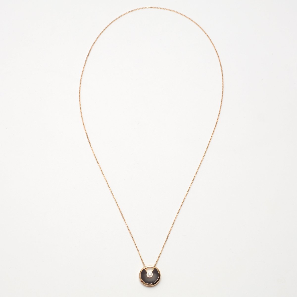 Sautoir Cartier Amulette PM en or rose et bois d'amourette - Castafiore