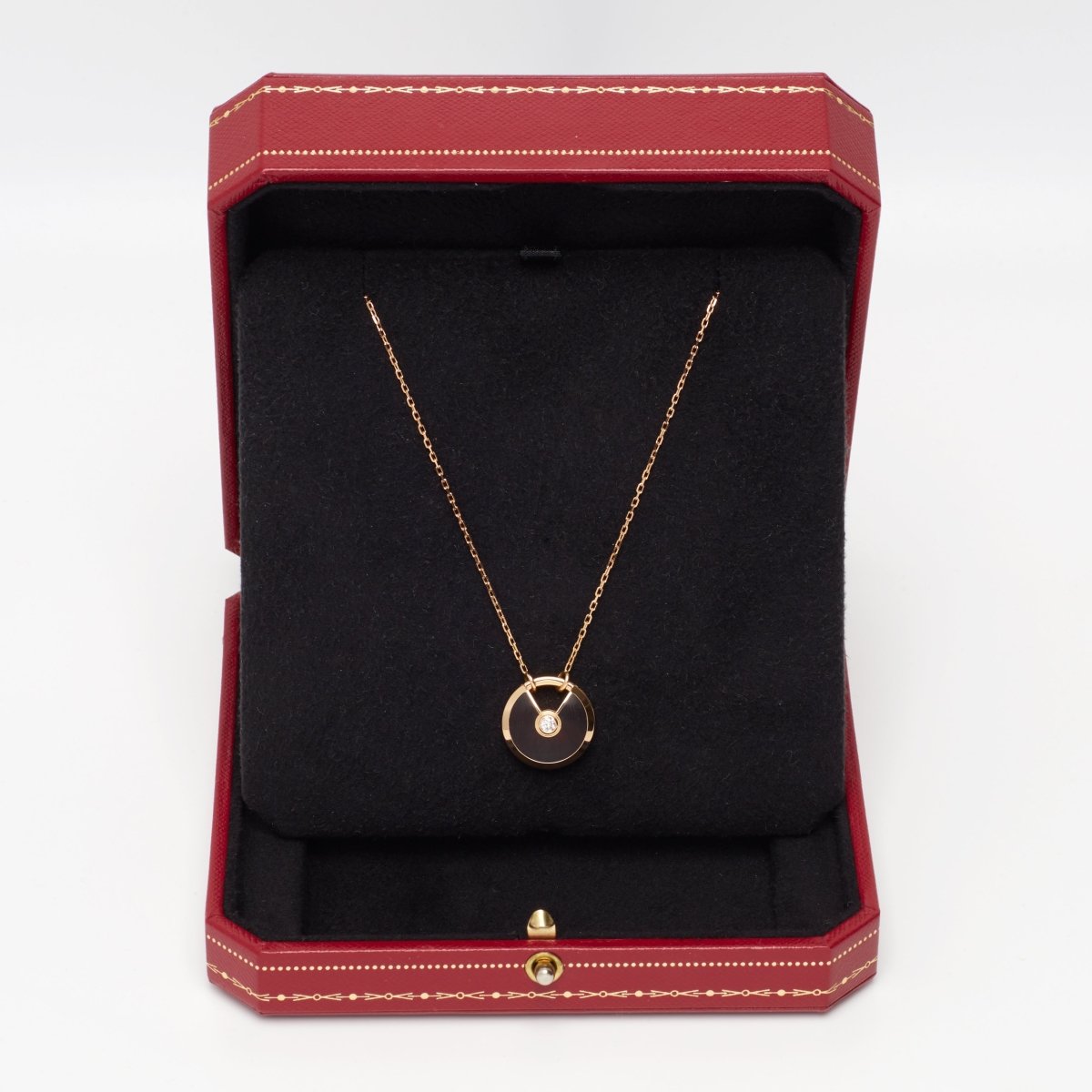 Sautoir Cartier Amulette PM en or rose et bois d'amourette - Castafiore