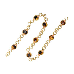 Trois bracelets BOUCHERON en or jaune et corail - Castafiore