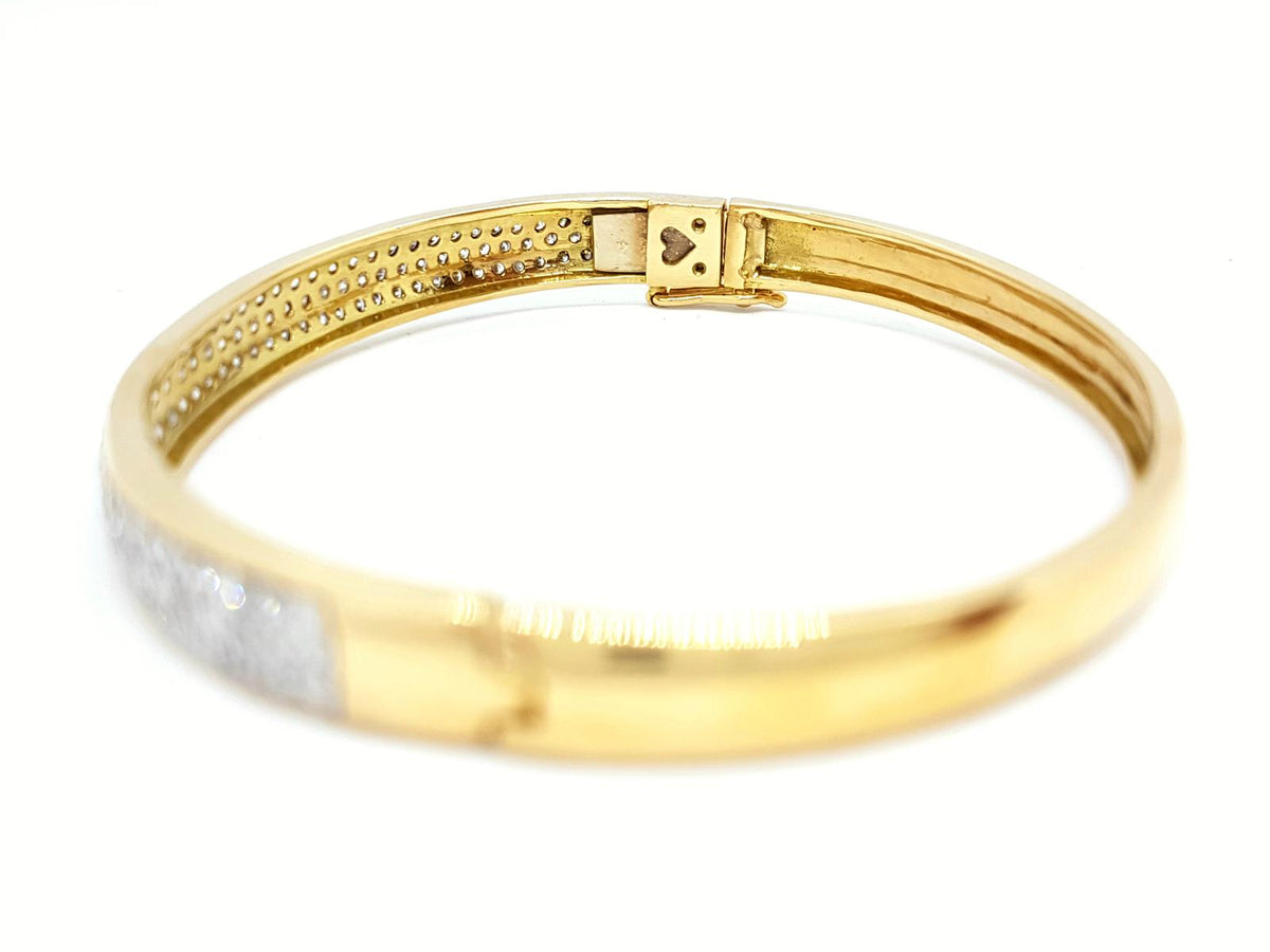 Yellow gold bangle bracelet paved with diamonds
