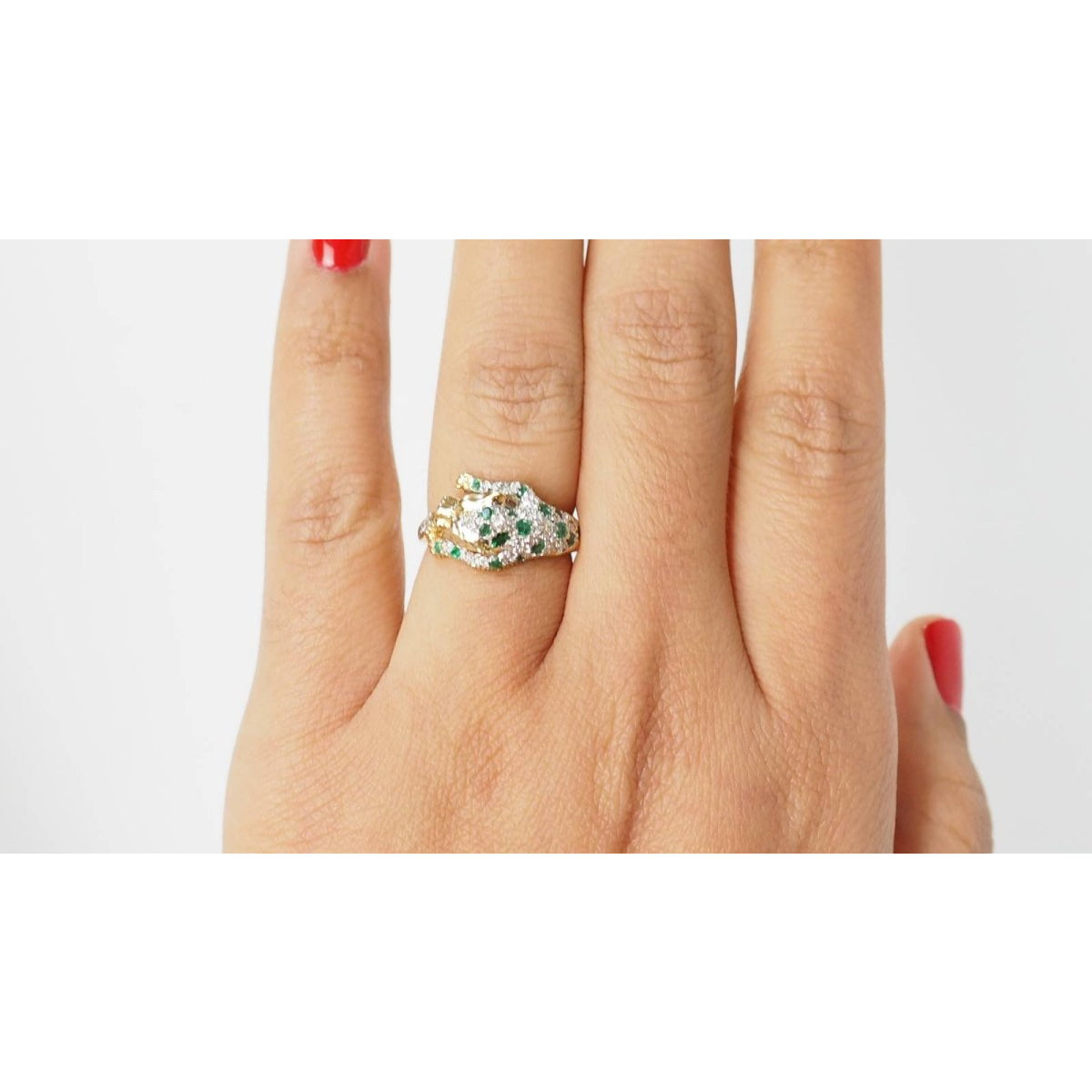 Bague panthère en or jaune, émeraudes et diamants - Castafiore