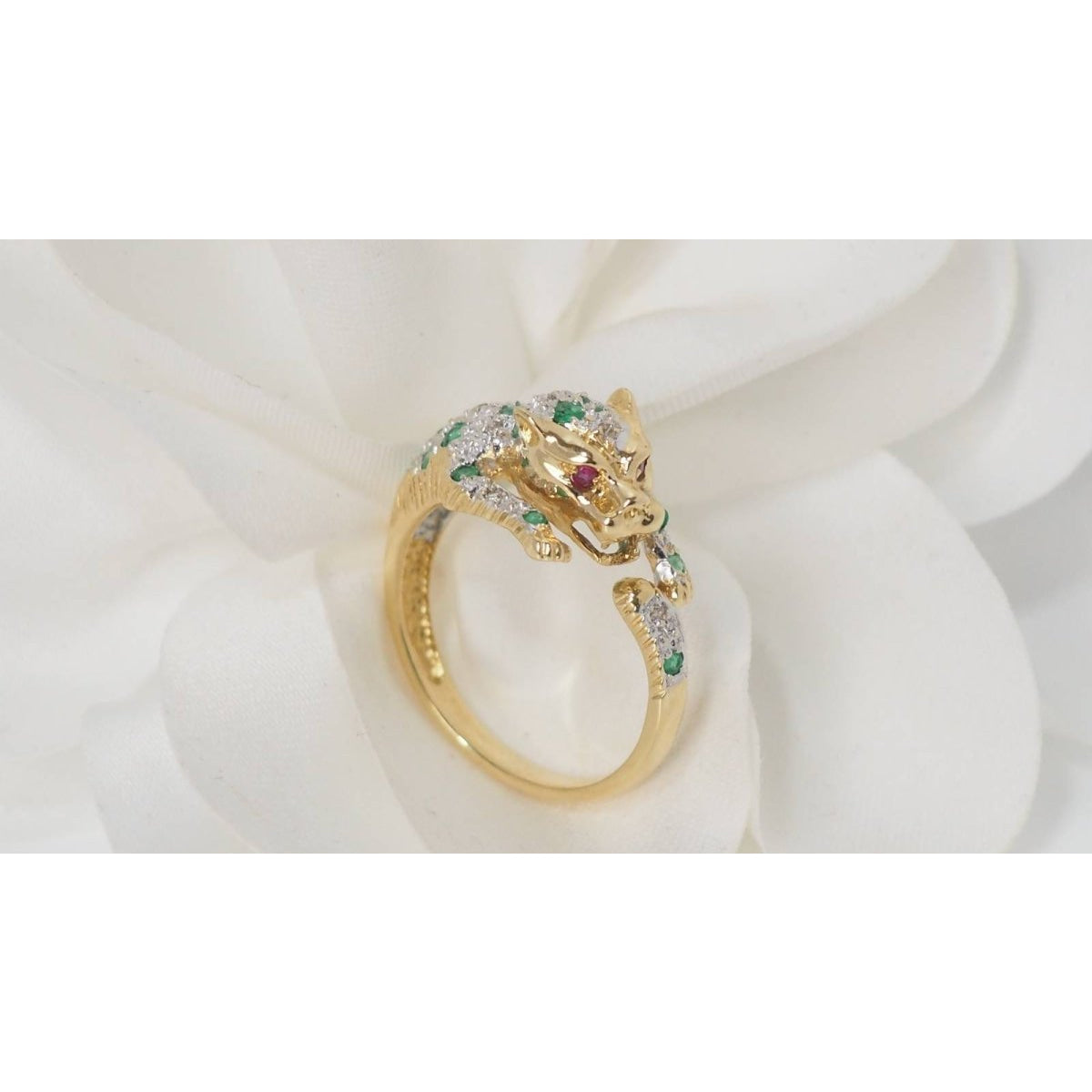 Bague panthère en or jaune, émeraudes et diamants - Castafiore