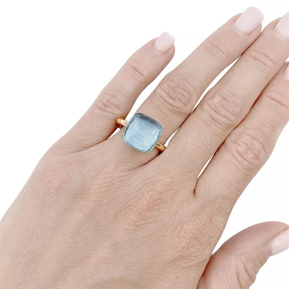 Bague Pomellato, "Nudo Maxi", deux ors et topaze bleue. - Castafiore