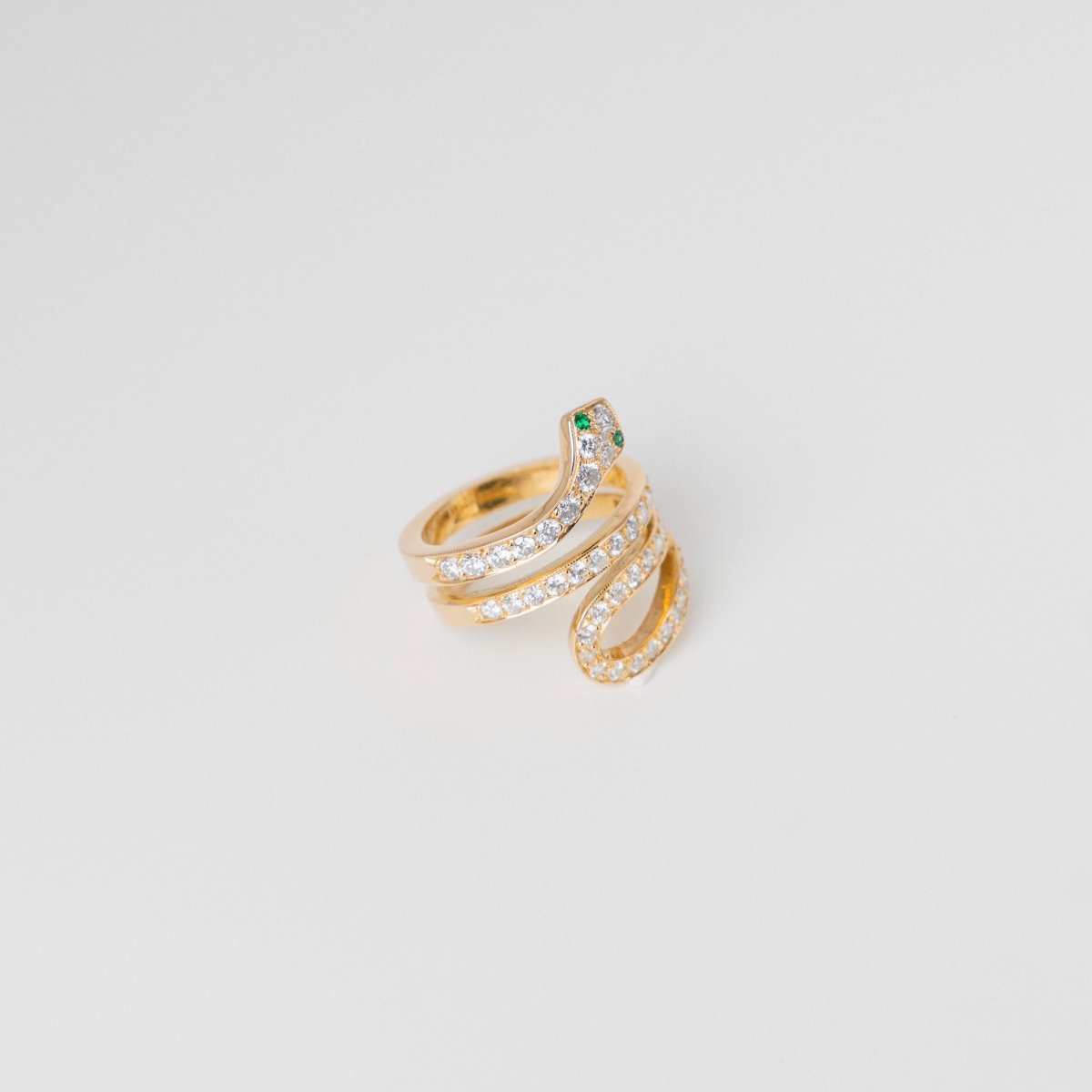 Bague Serpent en or jaune, diamants et émeraudes - Castafiore