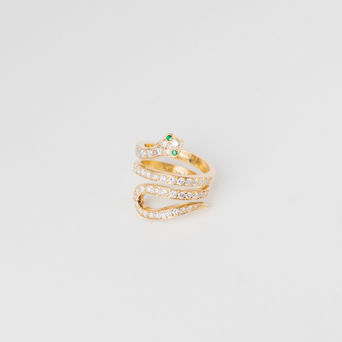 Bague Serpent en or jaune, diamants et émeraudes - Castafiore