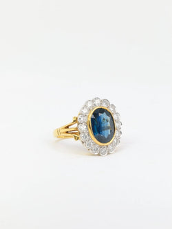 Bague vintage marguerite en or, saphir et diamants - Castafiore