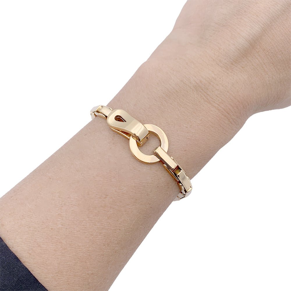 Bracelet Cartier "Agrafe" en or jaune. - Castafiore